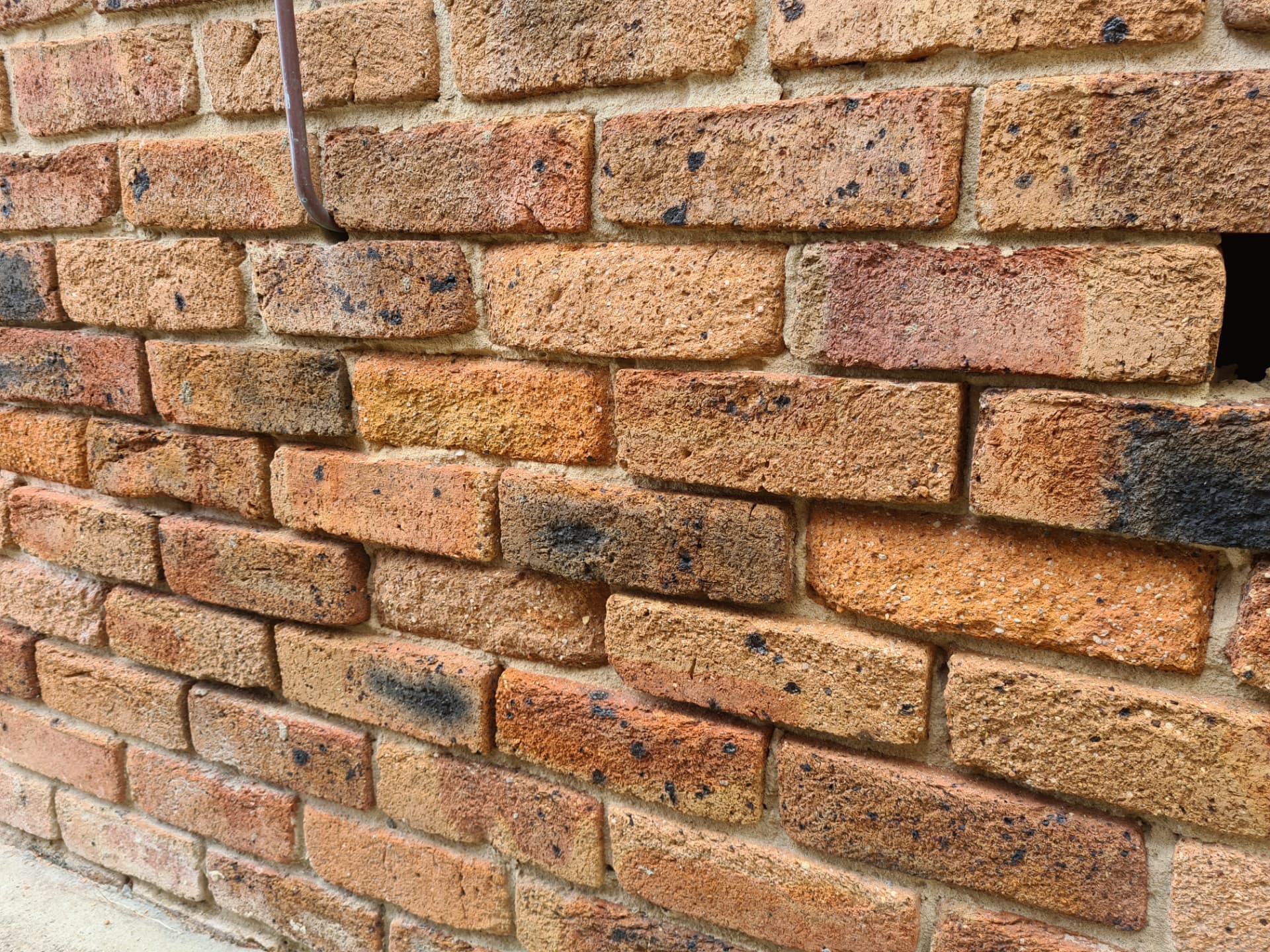 Fretted brickwork with crumbling brick faces